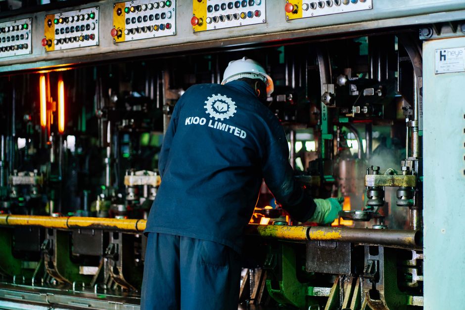 Worker supervises glass production at Kioo Limited factory in Dar es Salaam, Tanzania.