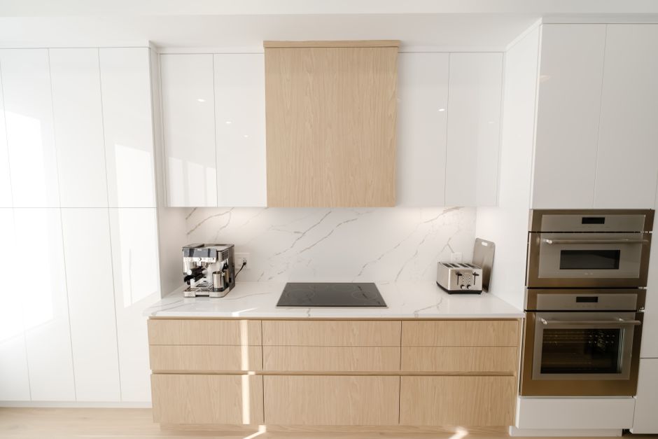 Contemporary kitchen design featuring sleek cabinetry and built-in appliances for a streamlined look.