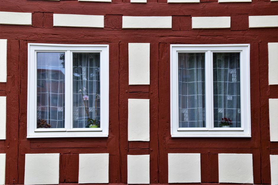 Close-up of a half-timbered house with white windows in Wolgast, Germany.