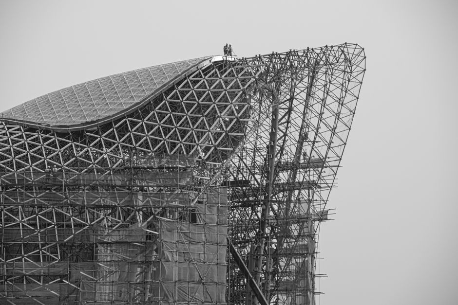 Black and white photo of modern architecture and scaffolding in Guilin, China.