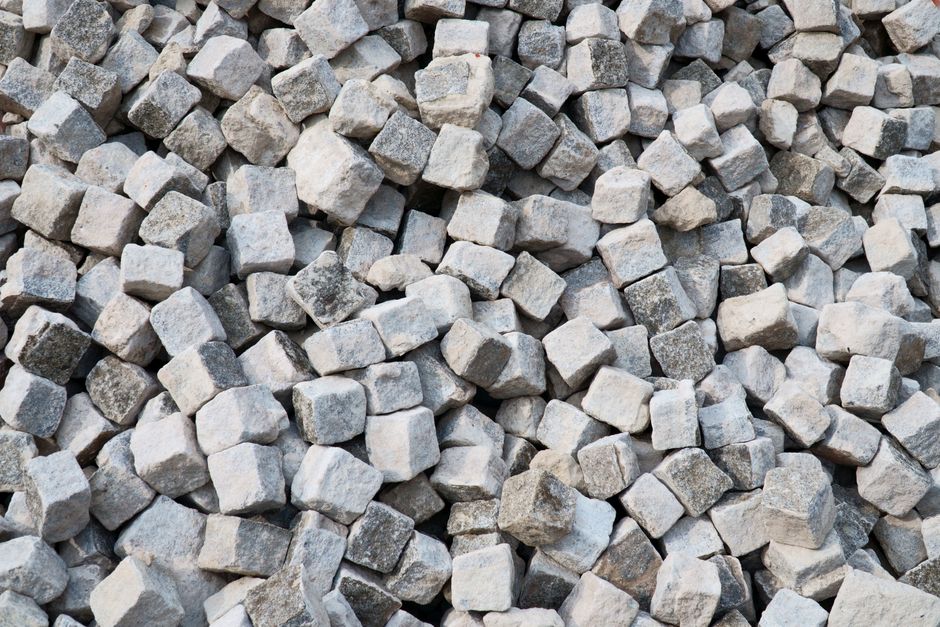 Heap of gray stone cubes ideal for construction projects and landscaping designs.