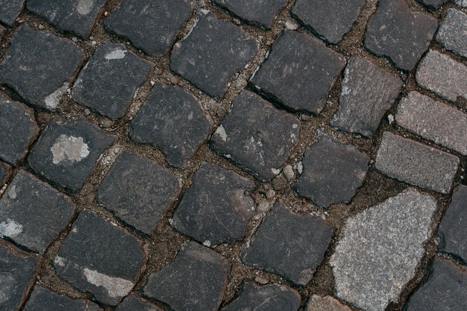 Detailed view of cobblestone pavement showing texture and arrangement.