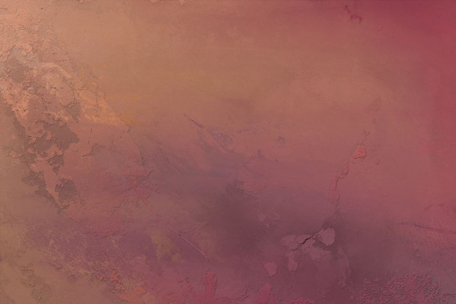 Close-up of a textured wall showcasing a blend of red and orange hues, perfect for artistic backgrounds.